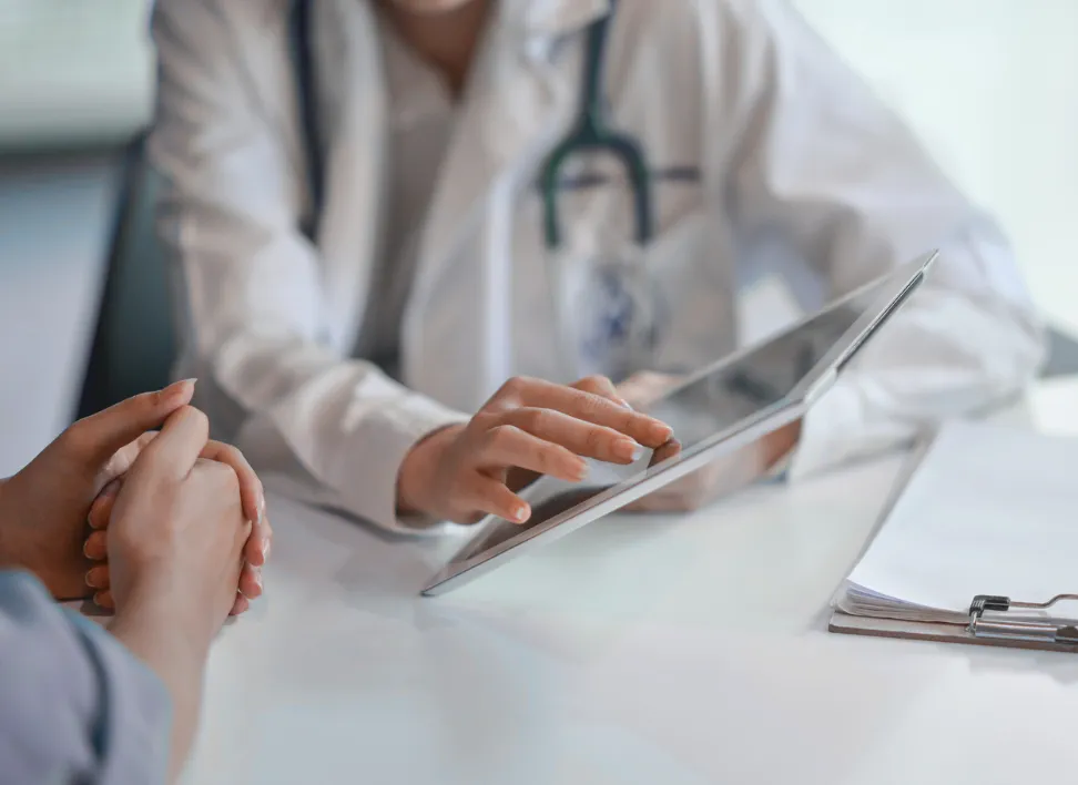 Clinician reviewing a patient’s hormone health during a consultation.