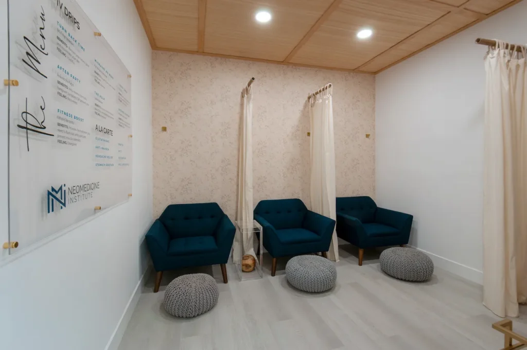 The Neomedicine Institute IV therapy room showcasing a board of different IV drips and seating areas.