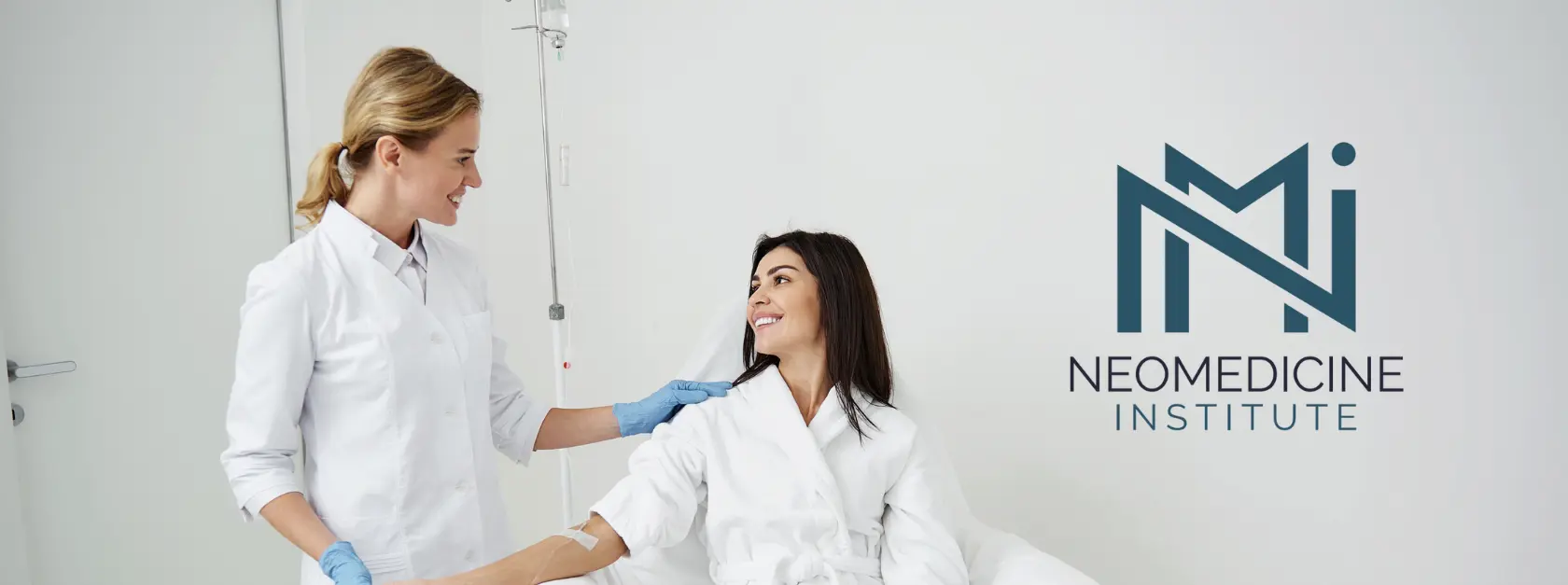 Woman in a wellness clinic with the NeoMedicine Institute logo before IV therapy treatment.