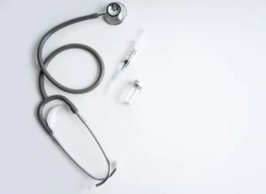 Medical tools arranged on a white surface for ketamine therapy.