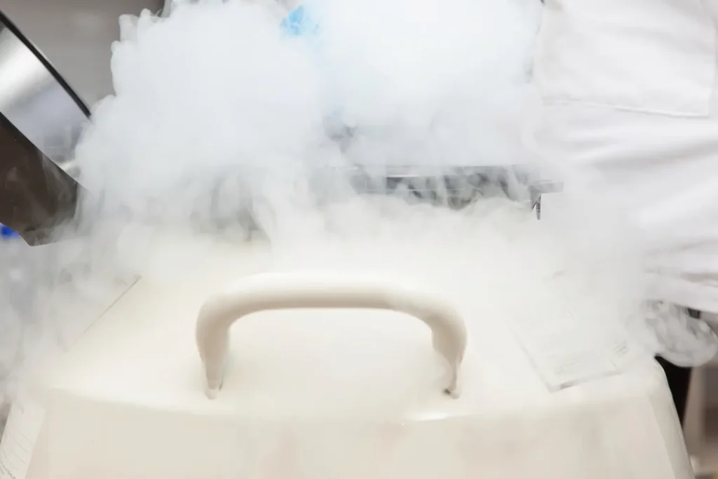 Cryogenic stem cell storage container releasing vapor during long term preservation process in regenerative medicine laboratory