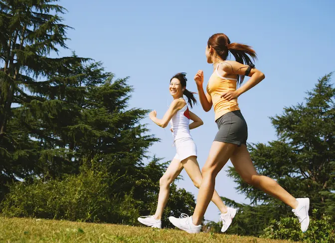 Women jogging outdoors representing healthy lifestyle during perimenopause and hormone balance