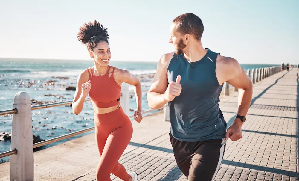 Active couple running outdoors representing longevity medicine and functional fitness at NeoMedicine Institute Miami FL